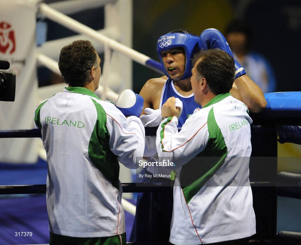 20 August 2008; Darren Sutherland, Ireland, is congratulated by head coach Billy Walsh and technical coach Zaur Antia after his victory over Alfonso Blanco Parra, from Venezuela, during their quarter-final bout of the Middle weight, 75kg, contest. Beijing 2008 - Games of the XXIX Olympiad, Beijing Workers Gymnasium, Olympic Green, Beijing, China. Picture credit: Ray McManus / SPORTSFILE