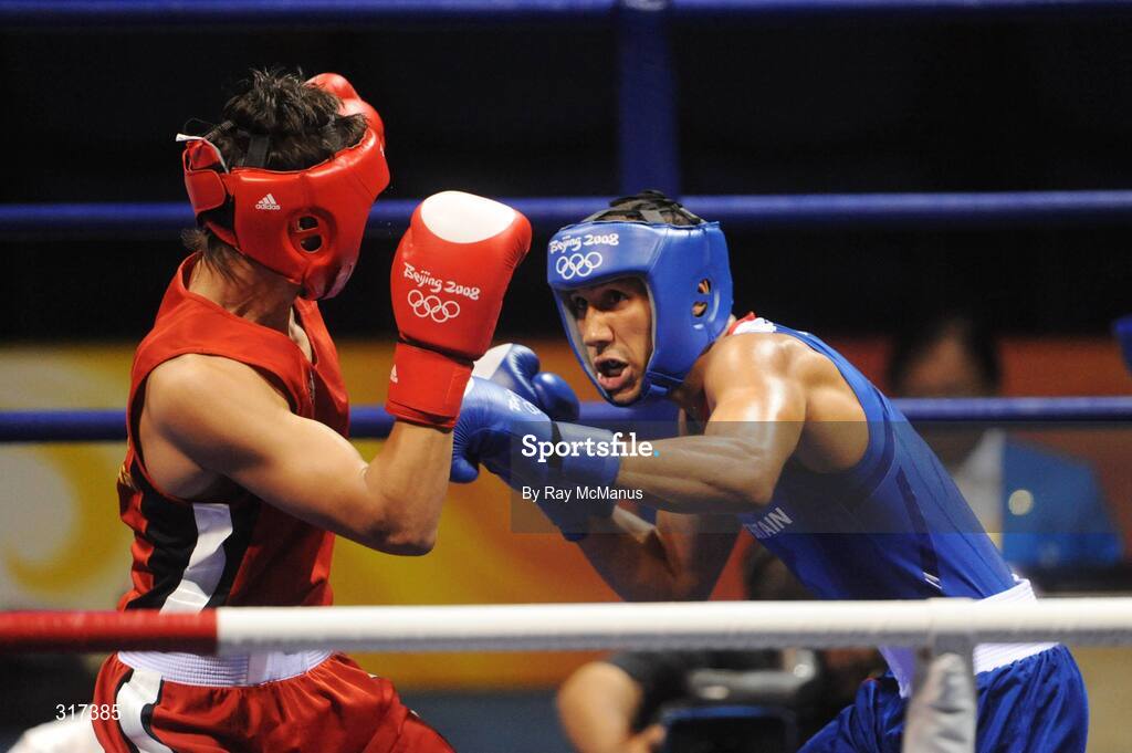 20 August 2008; James Degale, Great Britain, in action against Bakhtiyar Artayev, in red from Kazakastan, during their quarter-final bout of the Middle weight, 75kg, contest. Beijing 2008 - Games of the XXIX Olympiad, Beijing Workers Gymnasium, Olympic Green, Beijing, China. Picture credit: Ray McManus / SPORTSFILE