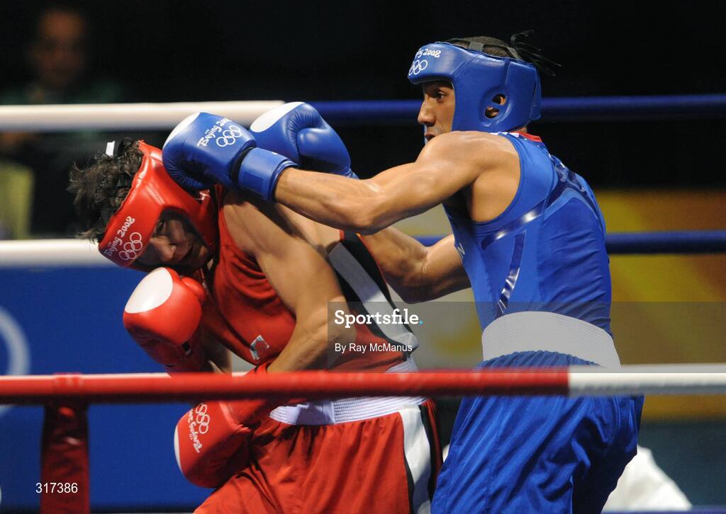 20 August 2008; James Degale, Great Britain, in action against Bakhtiyar Artayev, in red from Kazakastan, during their quarter-final bout of the Middle weight, 75kg, contest. Beijing 2008 - Games of the XXIX Olympiad, Beijing Workers Gymnasium, Olympic Green, Beijing, China. Picture credit: Ray McManus / SPORTSFILE