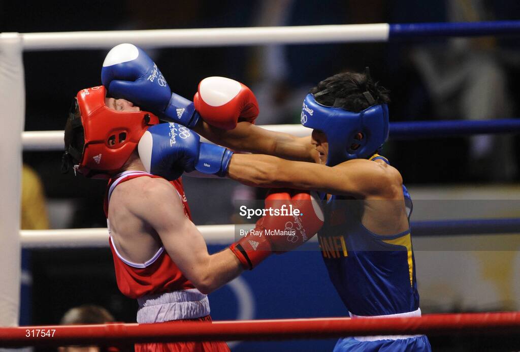 22 August 2008; Paddy Barnes, Ireland, in action against Shiming Zou, in blue from China, during their semi-final bout in the Light Fly weight, 48kg, contest. Beijing 2008 - Games of the XXIX Olympiad, Beijing Workers Gymnasium, Olympic Green, Beijing, China. Picture credit: Ray McManus / SPORTSFILE