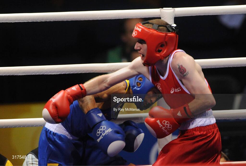 22 August 2008; Paddy Barnes, Ireland, in action against Shiming Zou, in blue from China, during their semi-final bout in the Light Fly weight, 48kg, contest. Beijing 2008 - Games of the XXIX Olympiad, Beijing Workers Gymnasium, Olympic Green, Beijing, China. Picture credit: Ray McManus / SPORTSFILE