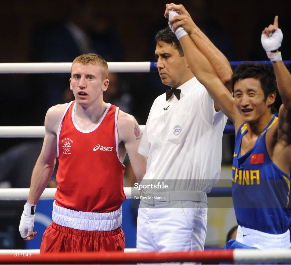 22 August 2008; Paddy Barnes, Ireland, shows his disappointment as the referee raises Shiming Zou's, China, arm in victory after their semi-final bout in the Light Fly weight, 48kg, contest. Beijing 2008 - Games of the XXIX Olympiad, Beijing Workers Gymnasium, Olympic Green, Beijing, China. Picture credit: Ray McManus / SPORTSFILE
