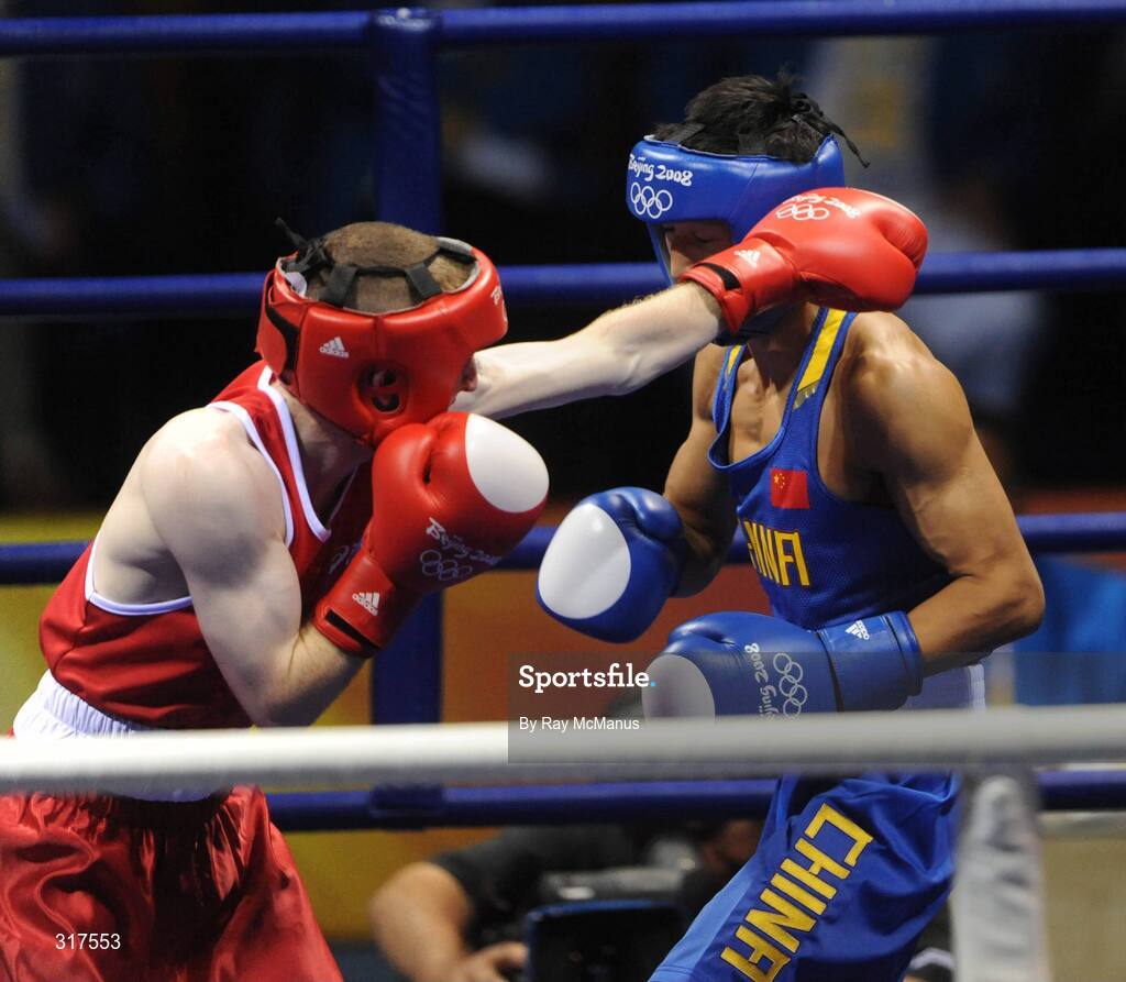22 August 2008; Paddy Barnes, Ireland, in action against Shiming Zou, in blue from China, during their semi-final bout in the Light Fly weight, 48kg, contest. Beijing 2008 - Games of the XXIX Olympiad, Beijing Workers Gymnasium, Olympic Green, Beijing, China. Picture credit: Ray McManus / SPORTSFILE