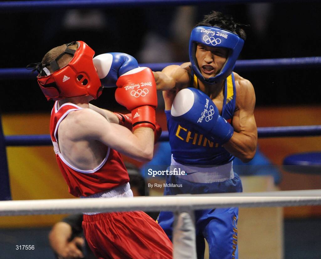 22 August 2008; Paddy Barnes, Ireland, in action against Shiming Zou, in blue from China, during their semi-final bout in the Light Fly weight, 48kg, contest. Beijing 2008 - Games of the XXIX Olympiad, Beijing Workers Gymnasium, Olympic Green, Beijing, China. Picture credit: Ray McManus / SPORTSFILE