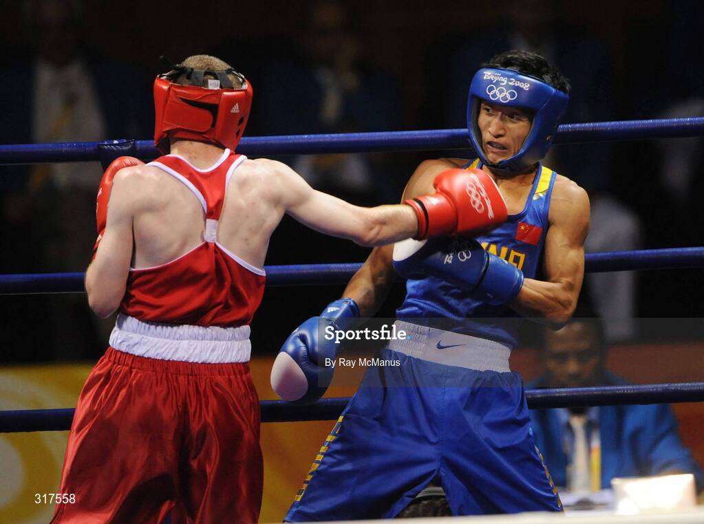 22 August 2008; Paddy Barnes, Ireland, in action against Shiming Zou, in blue from China, during their semi-final bout in the Light Fly weight, 48kg, contest. Beijing 2008 - Games of the XXIX Olympiad, Beijing Workers Gymnasium, Olympic Green, Beijing, China. Picture credit: Ray McManus / SPORTSFILE
