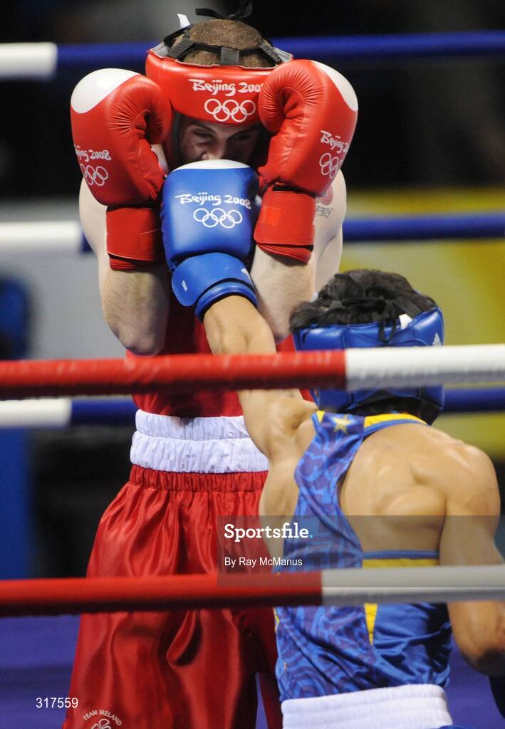 22 August 2008; Paddy Barnes, Ireland, in action against Shiming Zou, in blue from China, during their semi-final bout in the Light Fly weight, 48kg, contest. Beijing 2008 - Games of the XXIX Olympiad, Beijing Workers Gymnasium, Olympic Green, Beijing, China. Picture credit: Ray McManus / SPORTSFILE