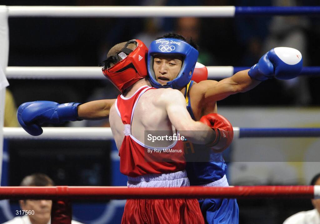 22 August 2008; Paddy Barnes, Ireland, in action against Shiming Zou, in blue from China, during their semi-final bout in the Light Fly weight, 48kg, contest. Beijing 2008 - Games of the XXIX Olympiad, Beijing Workers Gymnasium, Olympic Green, Beijing, China. Picture credit: Ray McManus / SPORTSFILE