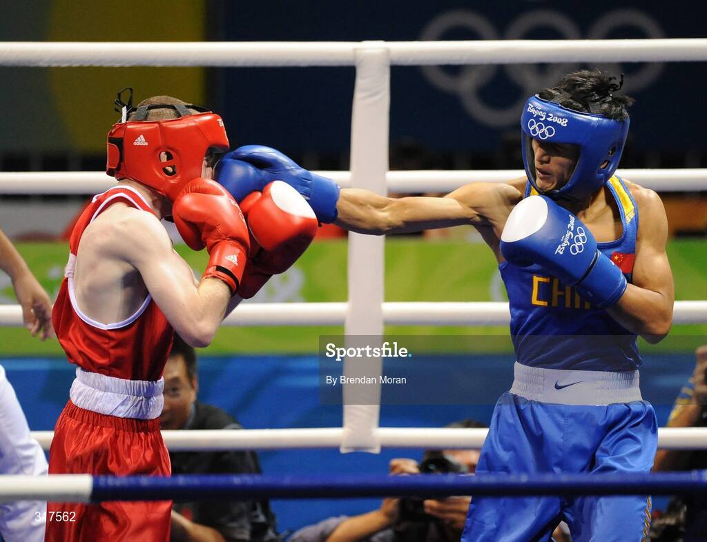 22 August 2008; Paddy Barnes, Ireland, is caught by Zou Sheming, in blue, China, during the first round of their semi-final bout in the Light Fly weight, 48kg, contest. Beijing 2008 - Games of the XXIX Olympiad, Beijing Workers' Gymnasium, Olympic Green, Beijing, China. Picture credit: Brendan Moran / SPORTSFILE