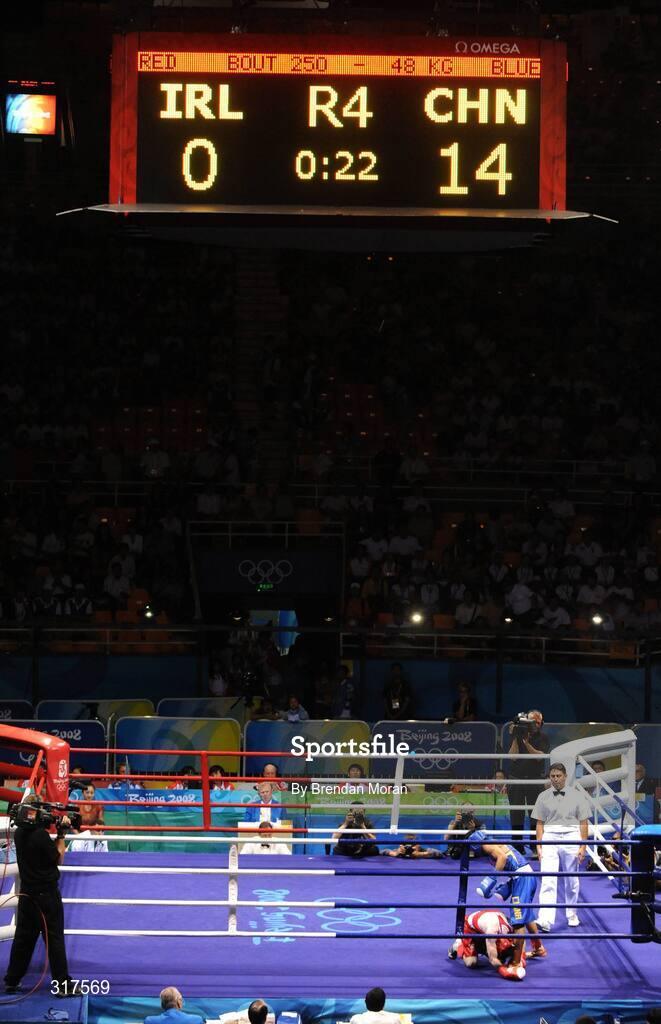22 August 2008; Paddy Barnes, Ireland, goes down on his knees in the last seconds against Zou Sheming, in blue, China, during their semi-final bout in the Light Fly weight, 48kg, contest. Beijing 2008 - Games of the XXIX Olympiad, Beijing Workers' Gymnasium, Olympic Green, Beijing, China. Picture credit: Brendan Moran / SPORTSFILE