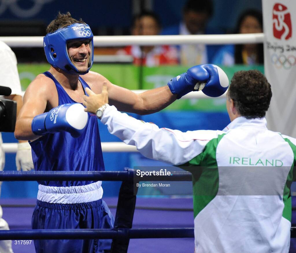 22 August 2008; Kenny Egan, Ireland, celebrates with head coach Billy Walsh after his victory over Tony Jeffries, Great Britain, during their semi-final bout in the Light Heavy weight, 81kg, contest. Beijing 2008 - Games of the XXIX Olympiad, Beijing Workers' Gymnasium, Olympic Green, Beijing, China. Picture credit: Brendan Moran / SPORTSFILE