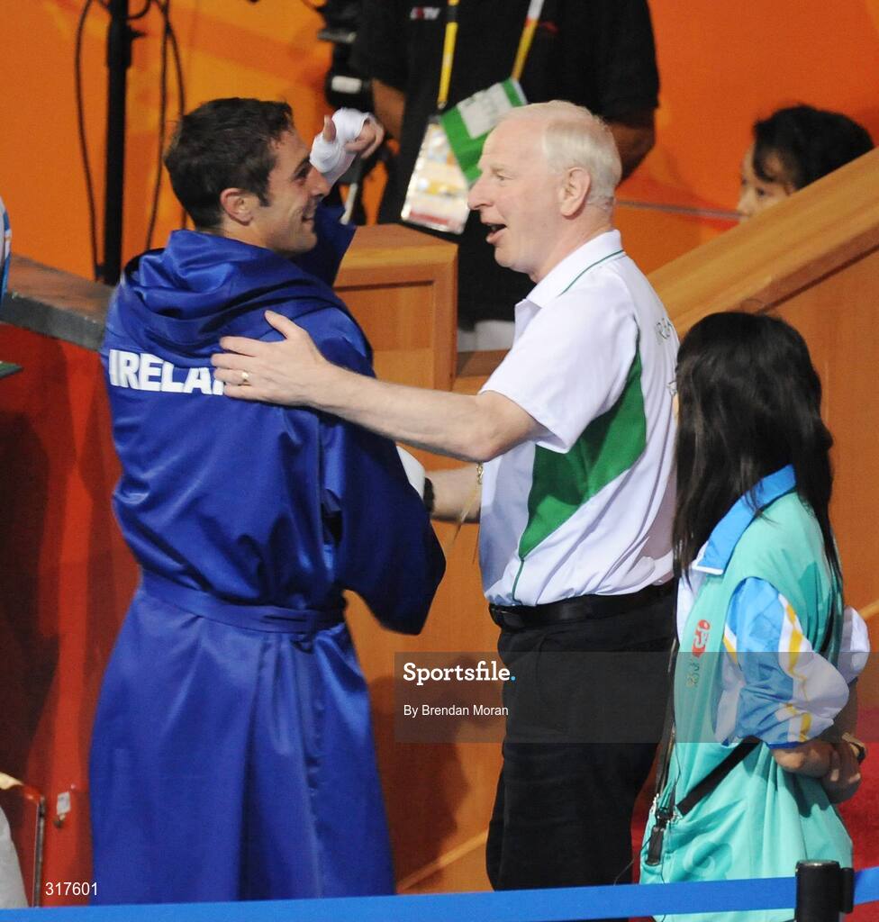 22 August 2008; Kenny Egan, Ireland, is congratulated by Pat Hickey, President, Olympic Council of Ireland, after his victory over Tony Jeffries, Great Britain, during their semi-final bout in the Light Heavy weight, 81kg, contest. Beijing 2008 - Games of the XXIX Olympiad, Beijing Workers' Gymnasium, Olympic Green, Beijing, China. Picture credit: Brendan Moran / SPORTSFILE