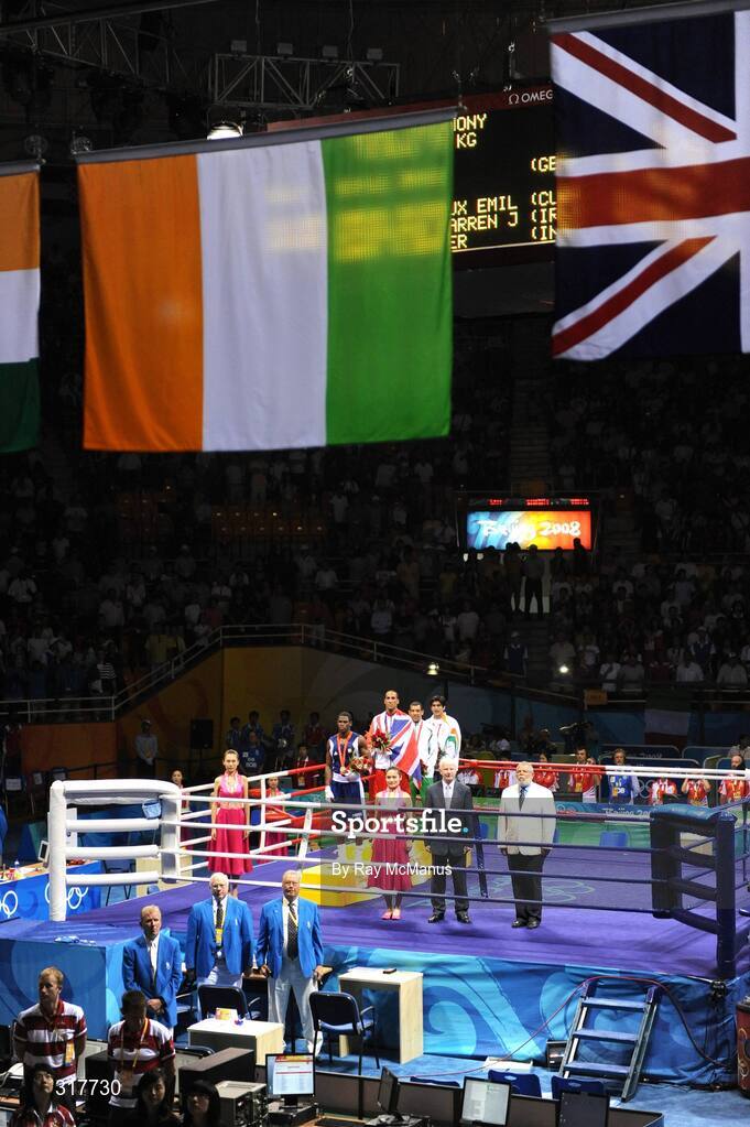 23 August 2008; The Tricolour is raised as Darren Sutherland, who was presented with an Olympic Bronze Medal after the final of the the Middleweight, 75kg, division, stands with other medal winners. Beijing 2008 - Games of the XXIX Olympiad, Beijing Workers' Gymnasium, Olympic Green, Beijing, China. Picture credit: Ray McManus / SPORTSFILE