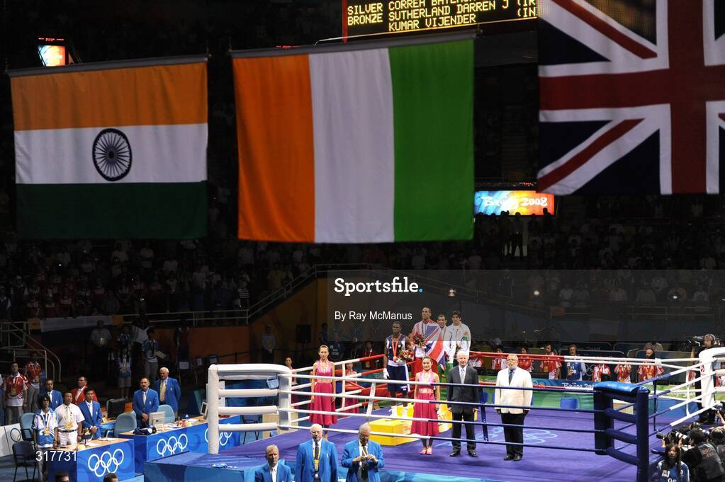 23 August 2008; The Tricolour is raised as Darren Sutherland, who was presented with an Olympic Bronze Medal after the final of the Middleweight, 75kg, division, stands with other medal winners. Beijing 2008 - Games of the XXIX Olympiad, Beijing Workers' Gymnasium, Olympic Green, Beijing, China. Picture credit: Ray McManus / SPORTSFILE