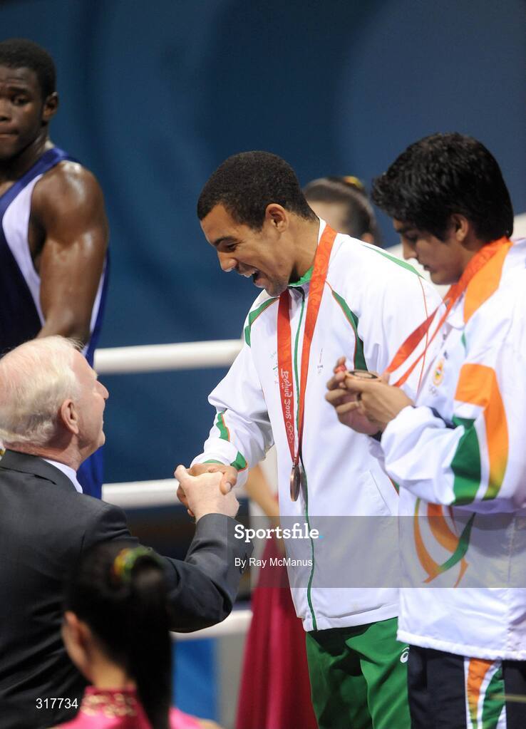 23 August 2008; Ireland's Darren Sutherland is presented with an Olympic Bronze Medal by Patrick Hickey, president of the Olympic Council of Ireland and president of the European Olympic Committee, after the final of the the Middleweight, 75kg, division. Beijing 2008 - Games of the XXIX Olympiad, Beijing Workers' Gymnasium, Olympic Green, Beijing, China. Picture credit: Ray McManus / SPORTSFILE
