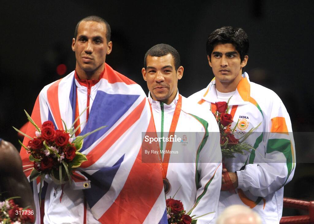 23 August 2008; Medal winners James Degale, gold, Great Britain, Darren Sutherland, bronze, Ireland, and Vijendar Kumar, silver, India, stand for the Nation Anthem after the medal presentation for the final of the Middleweight, 75kg, division. Beijing 2008 - Games of the XXIX Olympiad, Beijing Workers' Gymnasium, Olympic Green, Beijing, China. Picture credit: Ray McManus / SPORTSFILE
