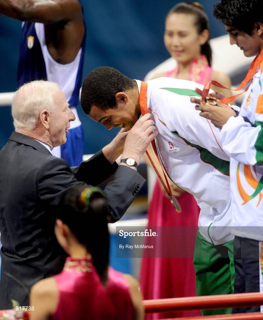 23 August 2008; Ireland's Darren Sutherland is presented with an Olympic Bronze Medal by Patrick Hickey, president of the Olympic Council of Ireland and president of the European Olympic Committee, after the final of the Middleweight, 75kg, division. Beijing 2008 - Games of the XXIX Olympiad, Beijing Workers' Gymnasium, Olympic Green, Beijing, China. Picture credit: Ray McManus / SPORTSFILE