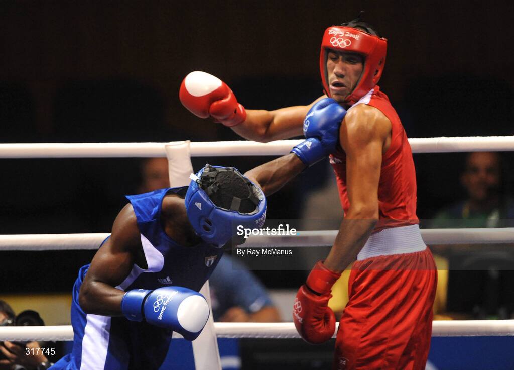 23 August 2008; James Degale, Great Britain, in action against Emilo Correa Bayeaux, in blue from Cuba, during the final of the the Middle weight, 75kg, division. Beijing 2008 - Games of the XXIX Olympiad, Beijing Workers' Gymnasium, Olympic Green, Beijing, China. Picture credit: Ray McManus / SPORTSFILE