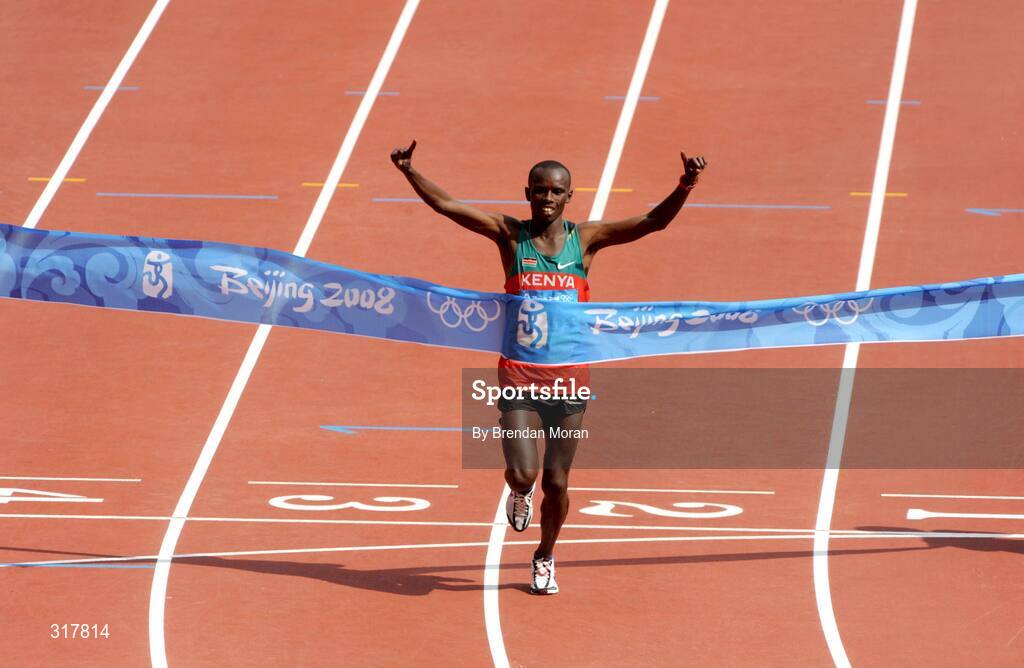 24 August 2008; Samuel Kamau Wansiru, Kenya, celebrates as he crosses the line to win the Men's Marathon. Beijing 2008 - Games of the XXIX Olympiad, National Stadium, Olympic Green, Beijing, China. Picture credit: Brendan Moran / SPORTSFILE