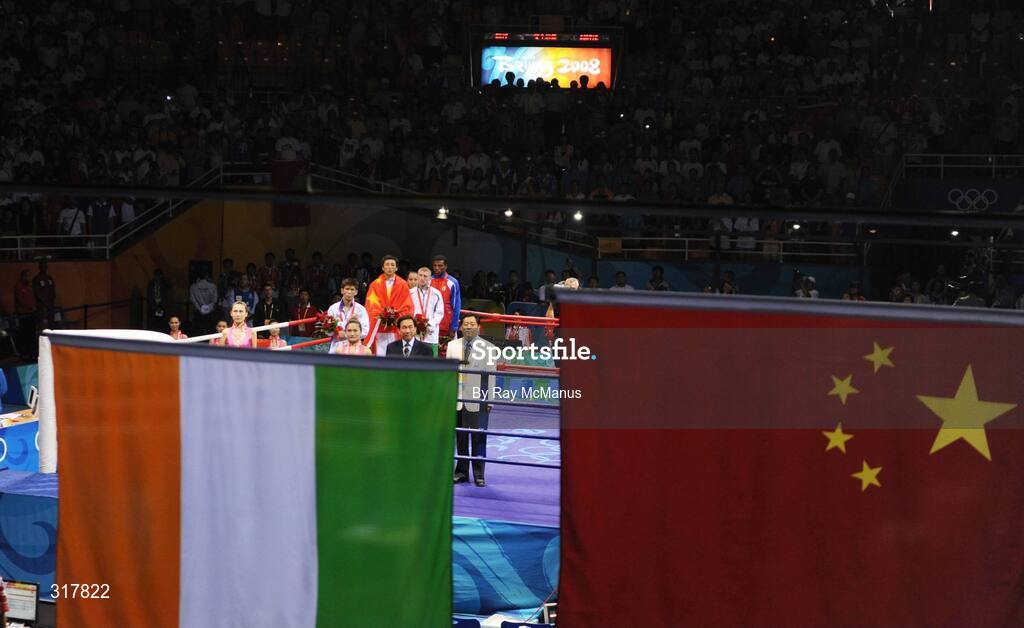 24 August 2008; Gold medal winner, Shiming Zou, China, silver medal winner, Serdamba Purecdorj, Mongolia, left, bronze medal winners, Paddy Barnes, Ireland and Yampier Hernandez, Cuba, stand for the National Anthem of China, after the presentation of medals in the Light Fly weight, 48kg, category. Beijing 2008 - Games of the XXIX Olympiad, Beijing Workers' Gymnasium, Olympic Green, Beijing, China. Picture credit: Ray McManus / SPORTSFILE