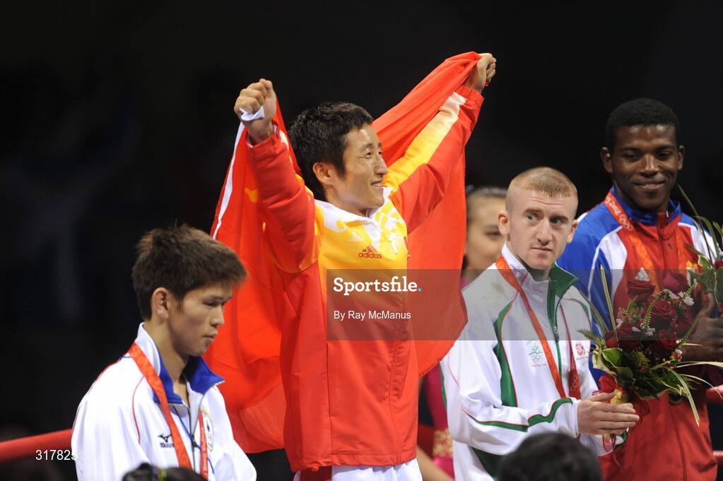 24 August 2008; Gold medal winner Shiming Zou celebrates as Ireland's Paddy Barnes looks on with his bronze medal that he won in the Light Fly weight, 48kg, category. Beijing 2008 - Games of the XXIX Olympiad, Beijing Workers' Gymnasium, Olympic Green, Beijing, China. Picture credit: Ray McManus / SPORTSFILE