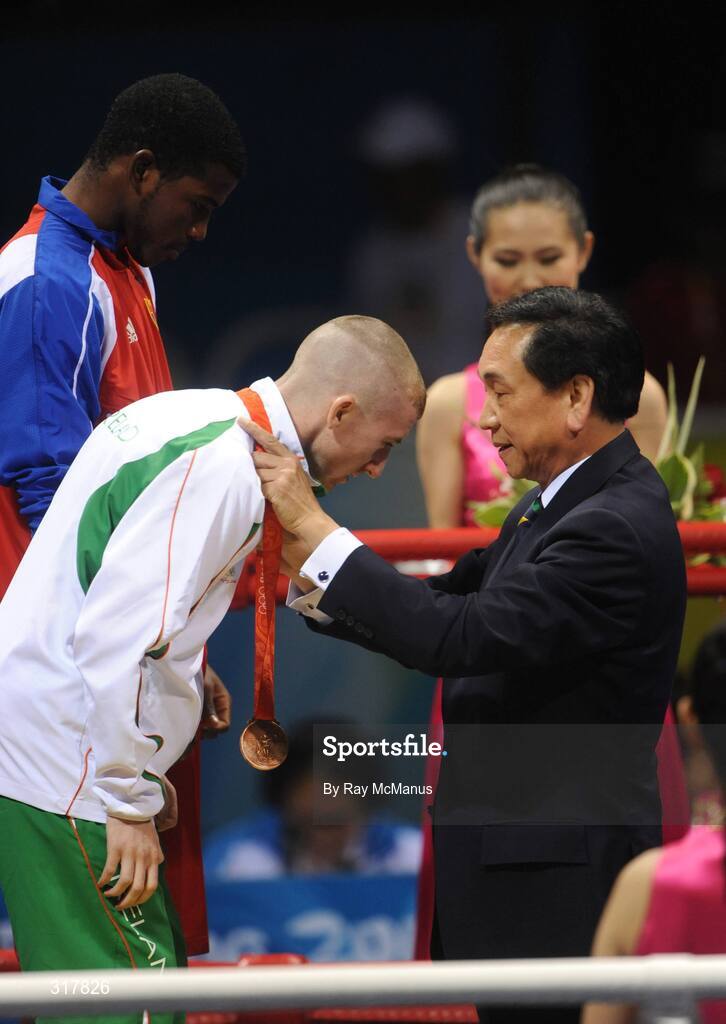 24 August 2008; Ireland's Paddy Barnes is presented with his bronze in the Light Fly weight, 48kg, category by Ching-kuo Wu, member of the International Olympic Committee. Beijing 2008 - Games of the XXIX Olympiad, Beijing Workers' Gymnasium, Olympic Green, Beijing, China. Picture credit: Ray McManus / SPORTSFILE