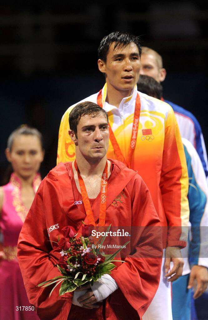 24 August 2008; Ireland's Kenneth Egan and gold medal winner, Xiaoping, China, stand for the National Anthem after the presentations in the Light Heavy weight, 81kg, category. Beijing 2008 - Games of the XXIX Olympiad, Beijing Workers' Gymnasium, Olympic Green, Beijing, China. Picture credit: Ray McManus / SPORTSFILE