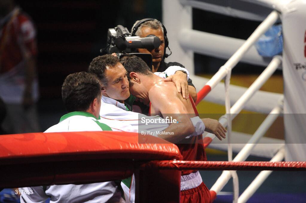 24 August 2008; Kenneth Egan, Ireland, is consoled by head coach Billy Walsh after his bout with Xiaoping Zhang, China, in the Light Heavy weight Final, 81kg, contest. Beijing 2008 - Games of the XXIX Olympiad, Beijing Workers' Gymnasium, Olympic Green, Beijing, China. Picture credit: Ray McManus / SPORTSFILE
