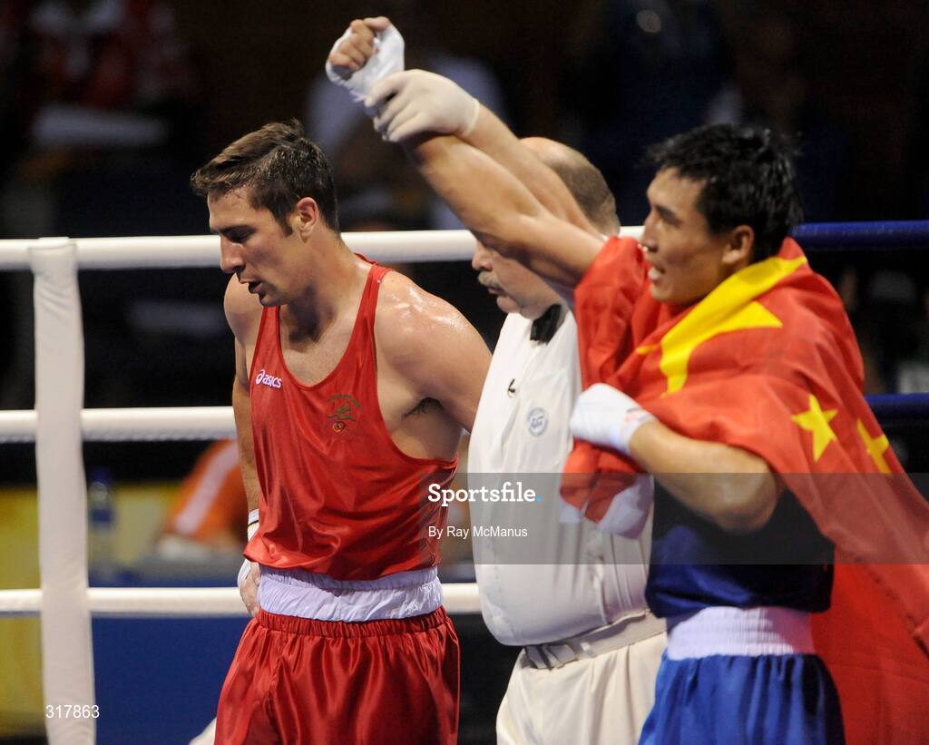 24 August 2008; Kenneth Egan, Ireland, shows his disappointment as the referee raises the arm of his opponent Xiaoping Zhang, China, in the Light Heavy weight Final, 81kg, contest. Beijing 2008 - Games of the XXIX Olympiad, Beijing Workers' Gymnasium, Olympic Green, Beijing, China. Picture credit: Ray McManus / SPORTSFILE