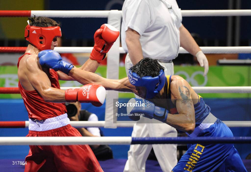 24 August 2008; Kenneth Egan, Ireland, is caught during his bout with Xiaoping Zhang, in blue, China, in the Light Heavy weight Final, 81kg, contest. Beijing 2008 - Games of the XXIX Olympiad, Beijing Workers' Gymnasium, Olympic Green, Beijing, China. Picture credit: Brendan Moran / SPORTSFILE