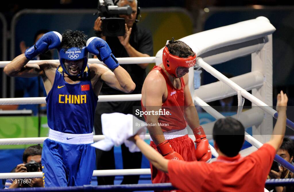 24 August 2008; Xiaoping Zhang, in blue, China, celebrates his victory over Kenneth Egan, Ireland, in the Light Heavy weight Final, 81kg, contest. Beijing 2008 - Games of the XXIX Olympiad, Beijing Workers' Gymnasium, Olympic Green, Beijing, China. Picture credit: Brendan Moran / SPORTSFILE