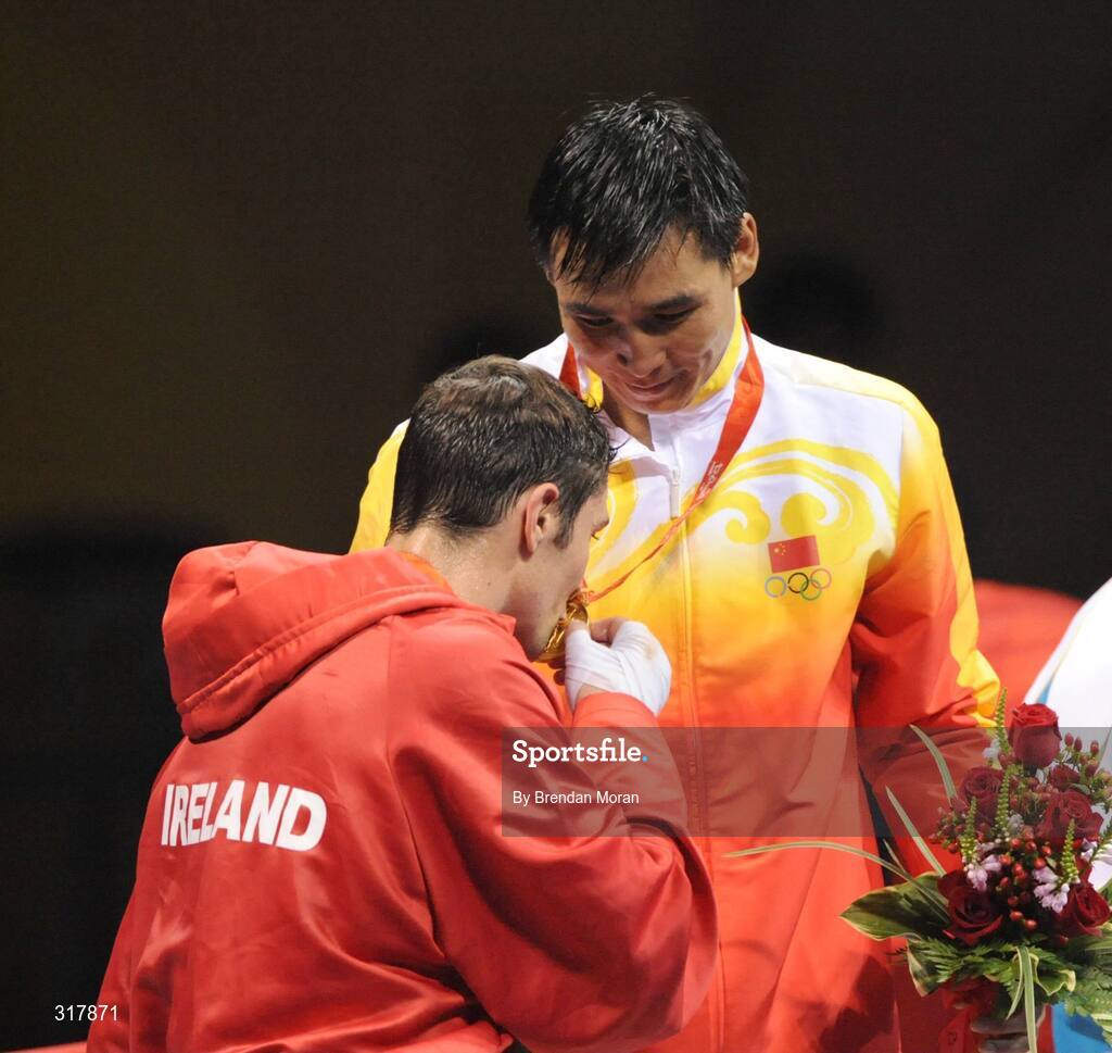 24 August 2008; Ireland's Kenneth Egan kisses the gold medal of his victor, Xiaoping Zhang, China, during the medal presentation of the Light Heavy weight, 81kg, category. Beijing 2008 - Games of the XXIX Olympiad, Beijing Workers' Gymnasium, Olympic Green, Beijing, China. Picture credit: Brendan Moran / SPORTSFILE
