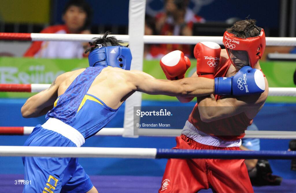 24 August 2008; Kenneth Egan, Ireland, is caught during his bout with Xiaoping Zhang, in blue, China, in the Light Heavy weight Final, 81kg, contest. Beijing 2008 - Games of the XXIX Olympiad, Beijing Workers' Gymnasium, Olympic Green, Beijing, China. Picture credit: Brendan Moran / SPORTSFILE