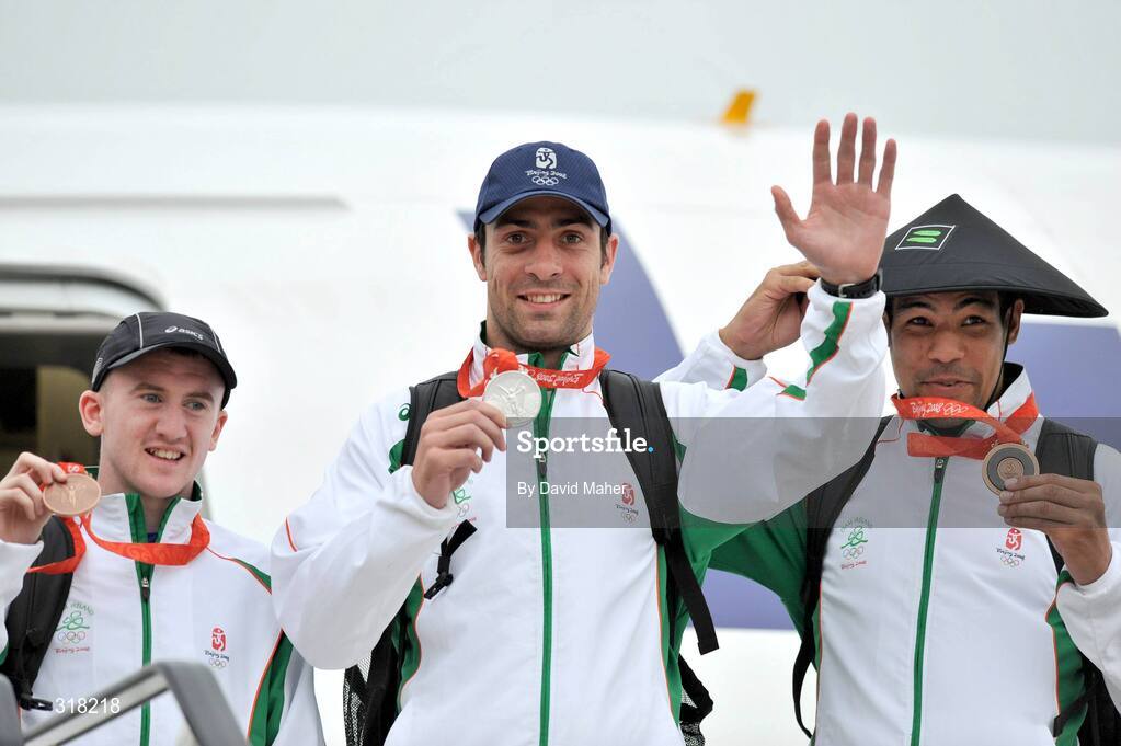 26 August 2008; The Irish Olympic Team, including silver medallist Kenny Egan, centre, bronze medallist Darren Sutherland, right, and bronze medallist Paddy Barnes, arrive at Dublin Airport, Dublin. Picture credit: David Maher / SPORTSFILE