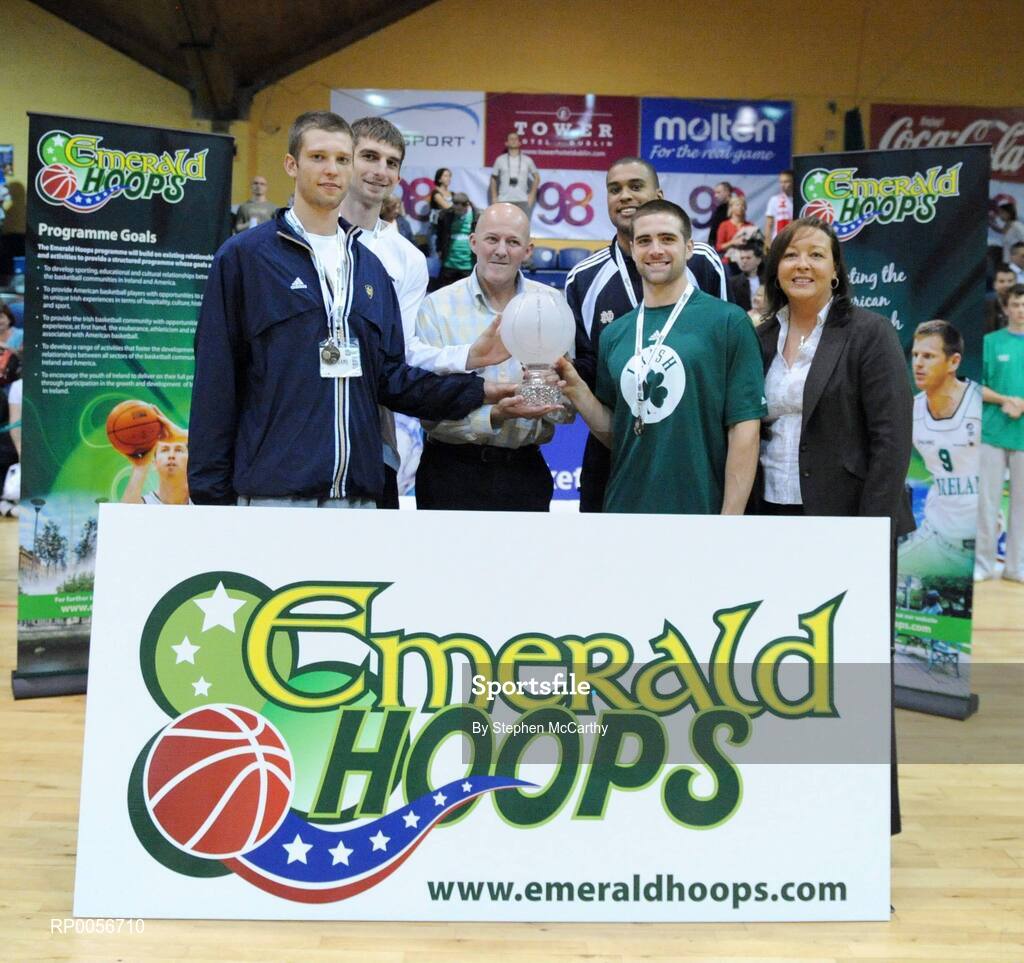 23 August 2008; Notre Dame captains, from left, Zach Hillesland, Luke Zeller, Ryan Ayers and Kyle McAlarney are presented with the trophy by Tony Colgan, President of Basketball Ireland, and Debbie Massey, CEO Basketball Ireland, after their side won the Emerald Hoops competition. Emerald Hoops Day 3, Ireland v Poland, National Basketball Arena, Tallaght, Co. Dublin. Picture credit: Stephen McCarthy / SPORTSFILE  *** Local Caption *** t colgan prw  debbie massey, ceo bbi