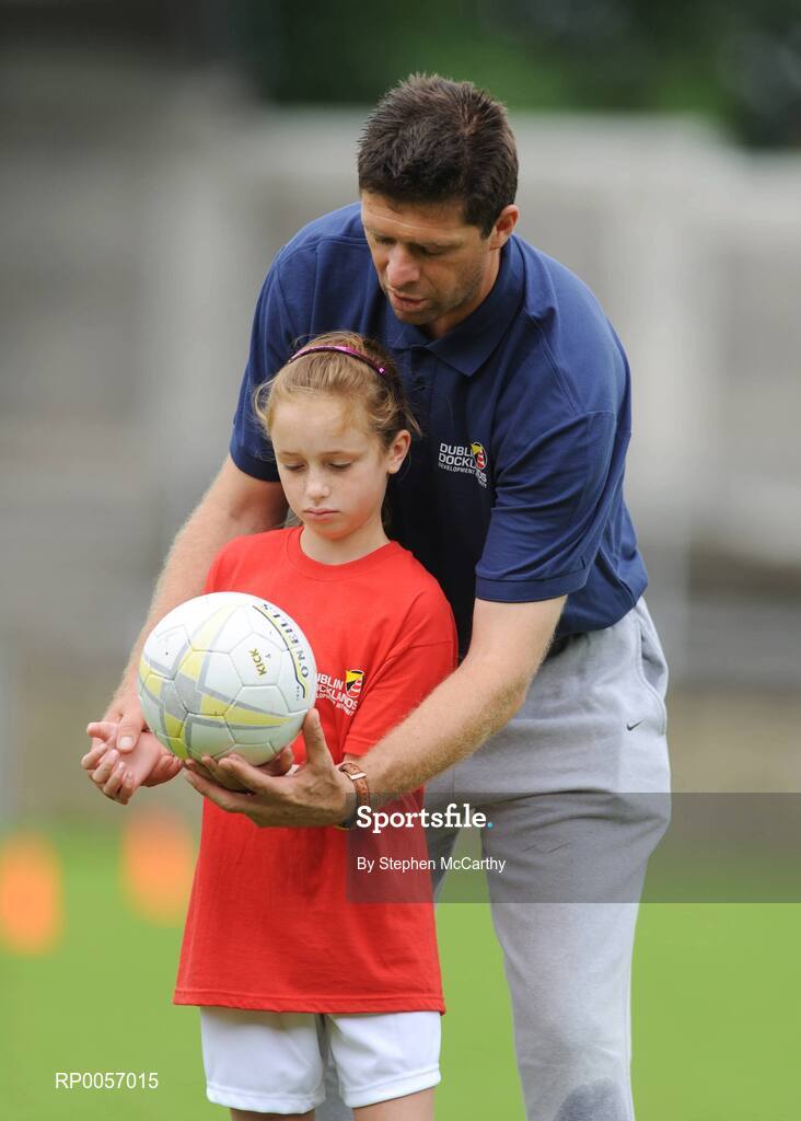 26 August 2008; Now in its sixth year, the Dublin Docklands Festival of Hurling and Gaelic Football helps young people from the Docklands develop their hurling and football skills. Today they had the experience of learning hurling and football skills from their sporting heroes Niall Quinn, Nicky English and Paul Casey during this year’s Docklands Festival of Hurling and Gaelic Football at Parnell Park. Pictured recieving instructions from Niall Quinn is Paige McGovern, age 9. Parnell Park, Dublin. Picture credit: Stephen McCarthy / SPORTSFILE