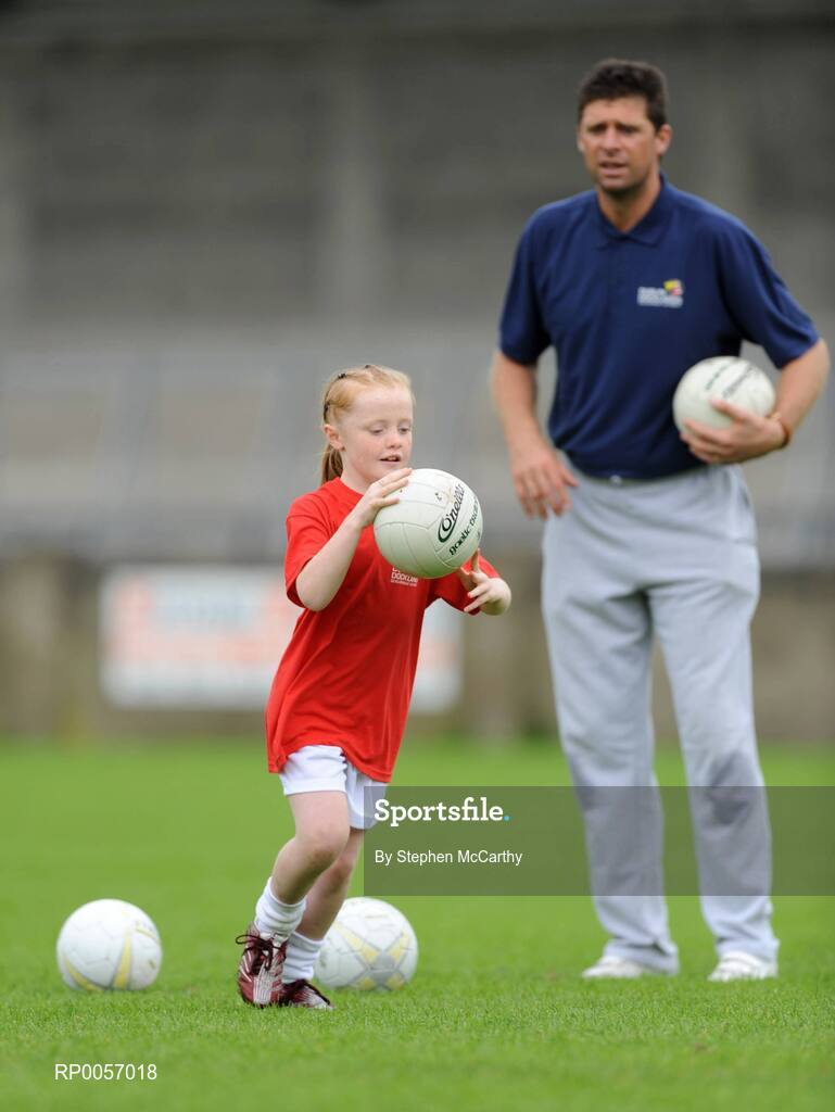 26 August 2008; Now in its sixth year, the Dublin Docklands Festival of Hurling and Gaelic Football helps young people from the Docklands develop their hurling and football skills. Today they had the experience of learning hurling and football skills from their sporting heroes Niall Quinn, Nicky English and Paul Casey during this year’s Docklands Festival of Hurling and Gaelic Football at Parnell Park. Pictured taking part is Jessica Hopkins, age 9, from Noth Wall, under the guidance of Niall Quinn. Parnell Park, Dublin. Picture credit: Stephen McCarthy / SPORTSFILE