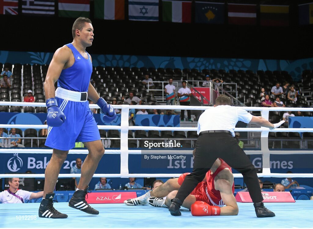 20 June 2015; Joe Joyce, Great Britain, knocks Alexei Zavatin, Moldova, to the canvas for the third time during the first round during their Men's Boxing Super Heavy +91kg Round of 16 bout. 2015 European Games, Crystal Hall, Baku, Azerbaijan. Picture credit: Stephen McCarthy / SPORTSFILE