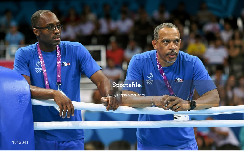 20 June 2015; France boxing coaches John Dovi, left, and Luis Mariano Gonzalez Cosme watch on during the Men's Boxing Welter 69kg Round of 16 bout between Souleymane Cissokho, France, and Balazs Bacskai, Hungary. 2015 European Games, Crystal Hall, Baku, Azerbaijan. Picture credit: Stephen McCarthy / SPORTSFILE