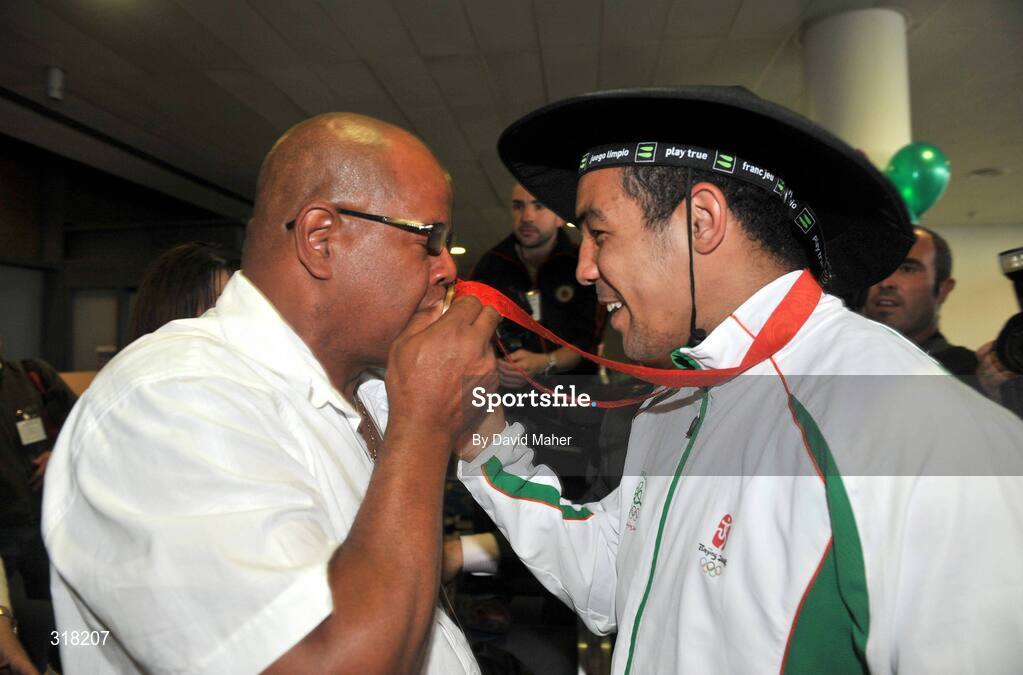 26 August 2008; Bronze medalist Darren Sutherland pictured with his father Tony after arriving at Dublin Airport with the Irish Olympic Team, Dublin. Picture credit: David Maher / SPORTSFILE