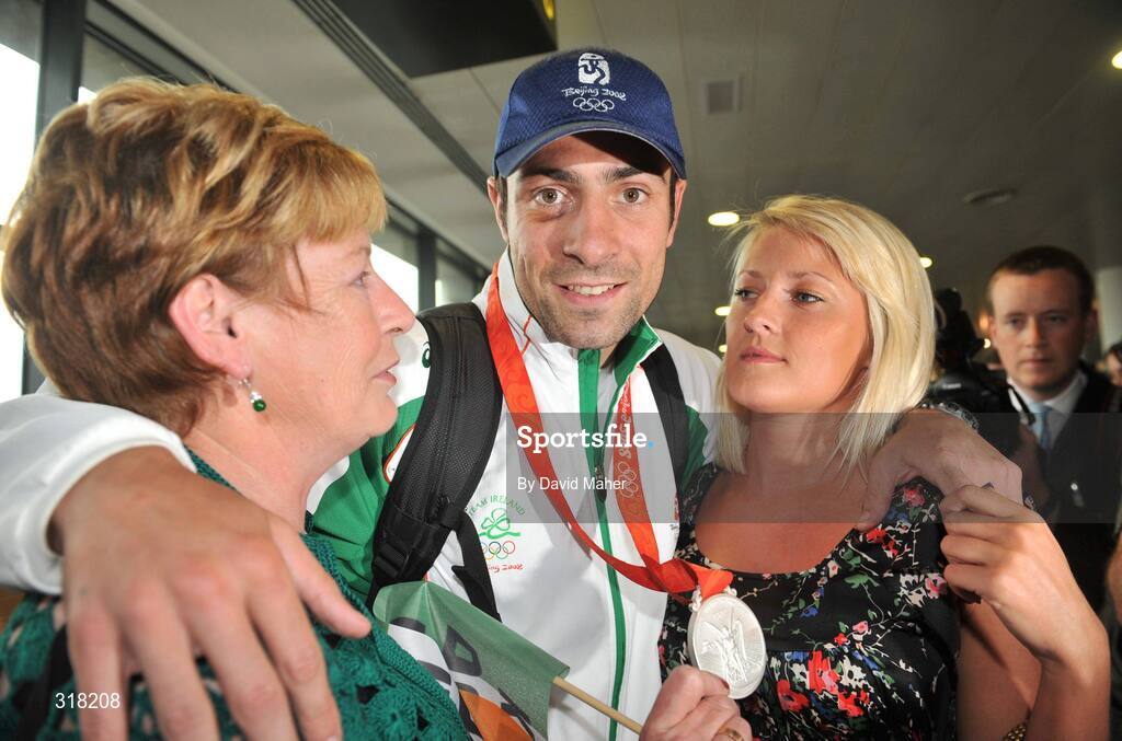 26 August 2008; Silver medalist Kenny Egan pictured with his mother Maura and girlfriend Karen Sullivan after arriving at Dublin Airport with the Irish Olympic Team, Dublin. Picture credit: David Maher / SPORTSFILE