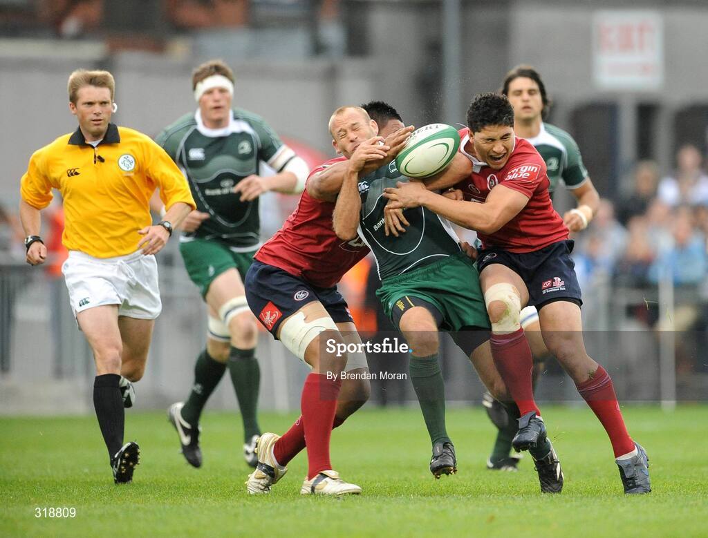 30 August 2008; Chris Whitaker, Leinster, is tackled by Poutusi Luafutu, left, and Ben Gollings, Queensland Reds. Pre-season friendly, Queensland Reds v Leinster, Donnybrook Stadium, Donnybrook, Dublin. Picture credit: Brendan Moran / SPORTSFILE