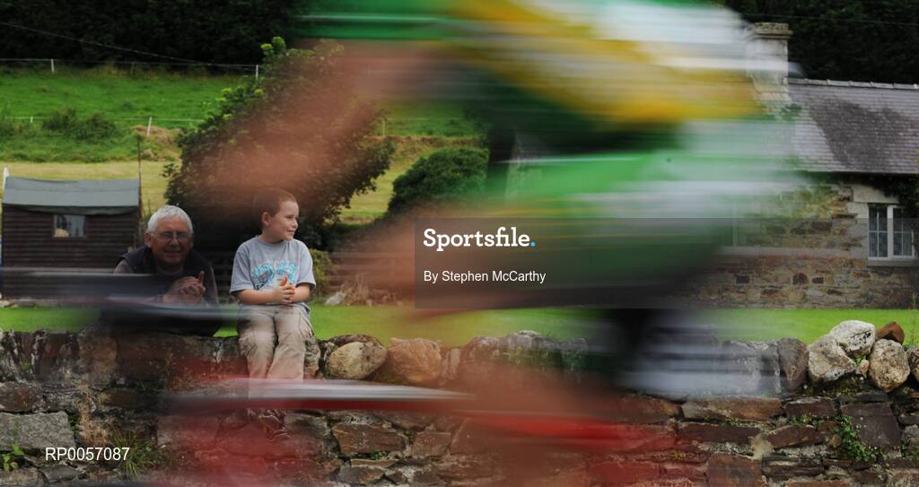 27 August 2008; Derek, left, and Adam Hayes, age 8, watch the race pass their home in Shillelagh, Co. Carlow. 2008 Tour of Ireland - Stage 1, Dublin - Waterford. Picture credit: Stephen McCarthy / SPORTSFILE  *** Local Caption ***
