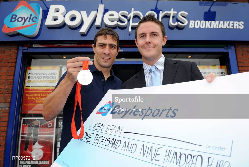 29 August 2008; Olympic boxing silver medalist Kenny Egan with Leon Blanche from Boylesports at the Boylesports shop in Neilstown. Kenny collected his winnings after he placed a bet on himself to win a medal in Beijing. Boylesports generously trebled his winnings and gave the same amount to Kenny’s club in Neilstown to prepare the boxers of the future. Boylseports, Clondalkin, Dublin. Picture credit: Brian Lawless / SPORTSFILE