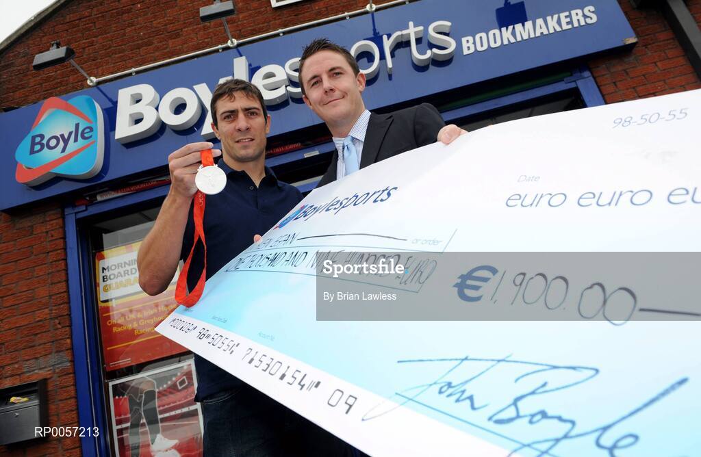 29 August 2008; Olympic boxing silver medalist Kenny Egan with Leon Blanche from Boylesports at the Boylesports shop in Neilstown. Kenny collected his winnings after he placed a bet on himself to win a medal in Beijing. Boylesports generously trebled his winnings and gave the same amount to Kenny’s club in Neilstown to prepare the boxers of the future. Boylseports, Clondalkin, Dublin. Picture credit: Brian Lawless / SPORTSFILE