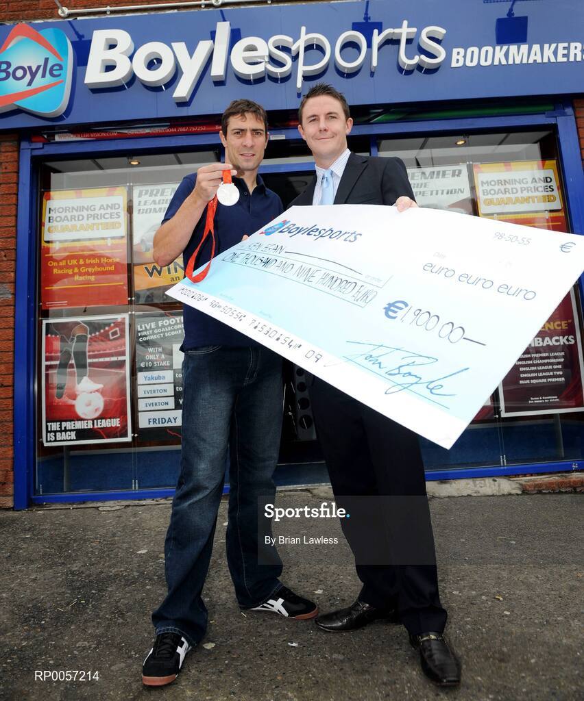 29 August 2008; Olympic boxing silver medalist Kenny Egan with Leon Blanche from Boylesports at the Boylesports shop in Neilstown. Kenny collected his winnings after he placed a bet on himself to win a medal in Beijing. Boylesports generously trebled his winnings and gave the same amount to Kenny’s club in Neilstown to prepare the boxers of the future. Boylseports, Clondalkin, Dublin. Picture credit: Brian Lawless / SPORTSFILE
