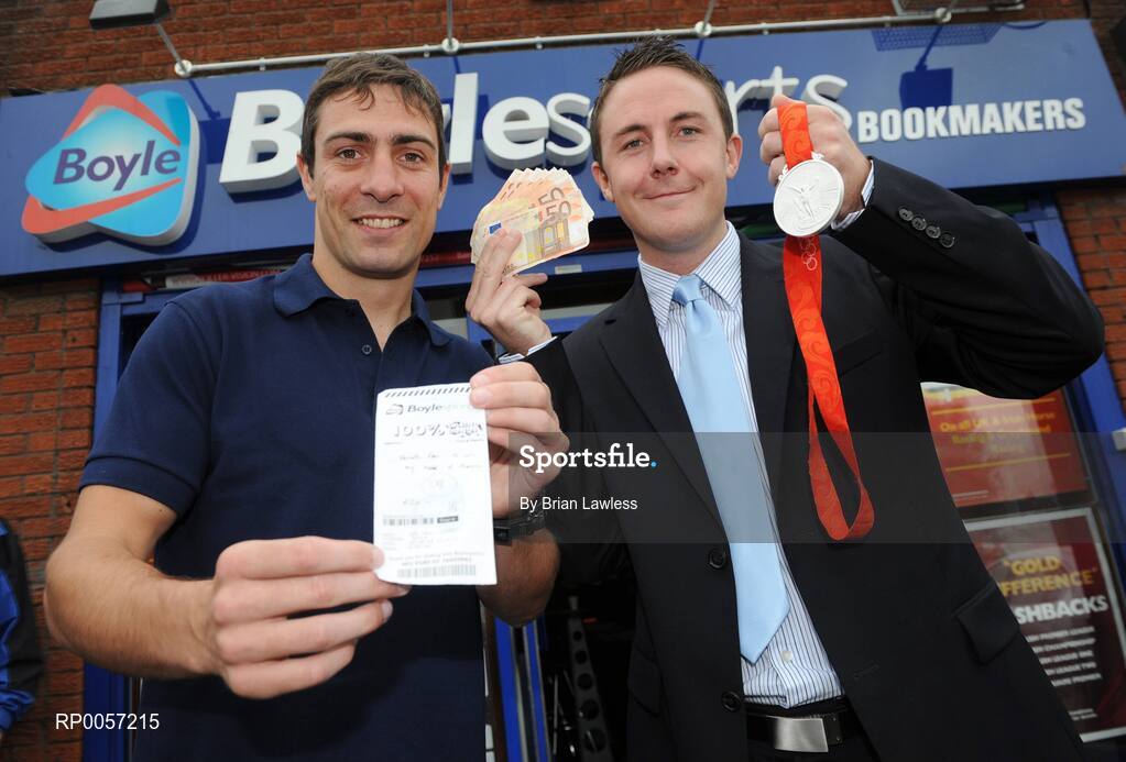 29 August 2008; Olympic boxing silver medalist Kenny Egan with Leon Blanche from Boylesports at the Boylesports shop in Neilstown. Kenny collected his winnings after he placed a bet on himself to win a medal in Beijing. Boylesports generously trebled his winnings and gave the same amount to Kenny’s club in Neilstown to prepare the boxers of the future. Boylseports, Clondalkin, Dublin. Picture credit: Brian Lawless / SPORTSFILE
