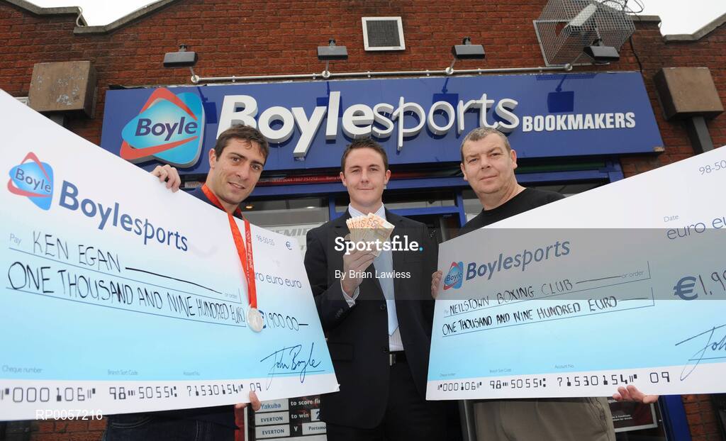 29 August 2008; Olympic boxing silver medalist Kenny Egan, left, with Leon Blanche from Boylesports, centre, and Gerard Flemming, Kenny's coach in Neilstown Boxing Club, at the Boylesports shop in Neilstown. Kenny collected his winnings after he placed a bet on himself to win a medal in Beijing. Boylesports generously trebled his winnings and gave the same amount to Kenny’s club in Neilstown to prepare the boxers of the future. Boylseports, Clondalkin, Dublin. Picture credit: Brian Lawless / SPORTSFILE