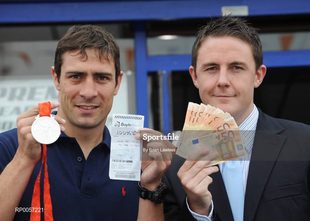 29 August 2008; Olympic boxing silver medalist Kenny Egan with Leon Blanche from Boylesports at the Boylesports shop in Neilstown. Kenny collected his winnings after he placed a bet on himself to win a medal in Beijing. Boylesports generously trebled his winnings and gave the same amount to Kenny’s club in Neilstown to prepare the boxers of the future. Boylseports, Clondalkin, Dublin. Picture credit: Brian Lawless / SPORTSFILE