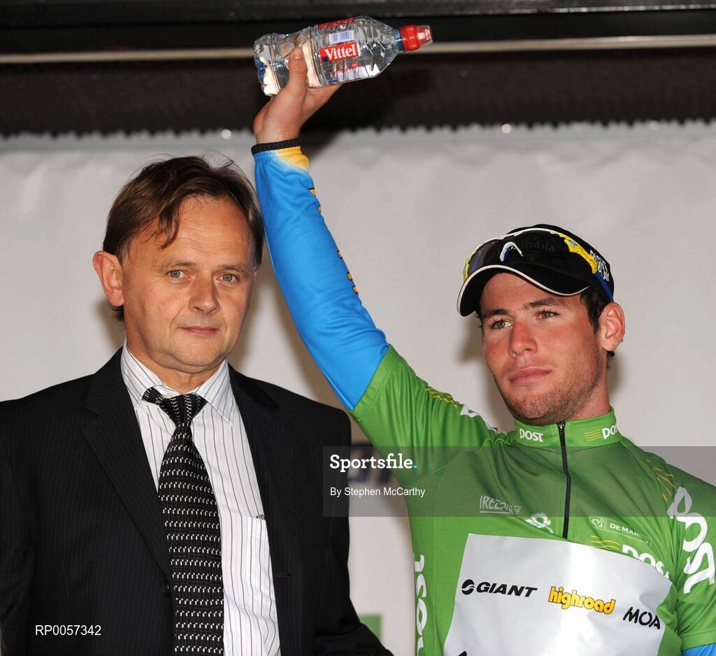 30 August 2008; Mark Cavendish, Team Columbia, after being presented with the An Post sponsored green jersey by Michael Cronin, An Post Retail Operations Manager South Region, left. 2008 Tour of Ireland - Stage 4, Limerick - Dingle. Picture credit: Stephen McCarthy / SPORTSFILE