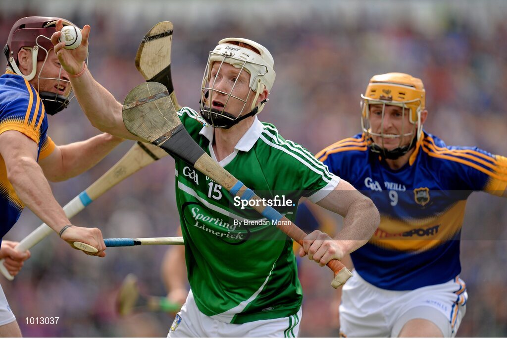 21 June 2015; Cian Lynch, Limerick, in action against Paddy Stapleton, left, and Shane McGrath, Tipperary. Munster GAA Hurling Senior Championship, Semi-Final, Limerick v Tipperary, Gaelic Grounds, Limerick. Picture credit: Brendan Moran / SPORTSFILE